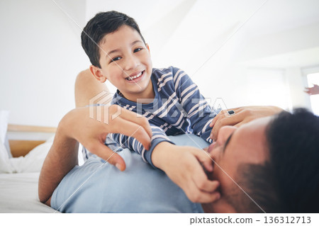 Family, boy portrait and hug with fun and smile in a home with bonding and parent care. Happy, house and bedroom with a father and young child together playing in the morning with dad and kid 136312713