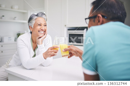 Senior couple, smile and cheers in a kitchen with toast and love celebration drink. Home, juice and cocktail together of elderly man and woman happy of support and care with marriage and anniversary Senior couple, smile and cheers in a kitchen with toast and love celebration drink. Home, juice and cocktail together of elderly man and woman happy of support and care with marriage and anniversary 136312744