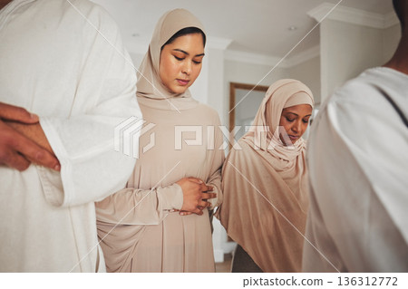 Prayer, muslim and islamic with women in living room for eid mubarak, God and worship. Quran, hope and Ramadan with spiritual family praying dua at home for faith, religion and gratitude Prayer, muslim and islamic with women in living room for eid mubarak, God and worship. Quran, hope and Ramadan with spiritual family praying dua at home for faith, religion and gratitude 136312772
