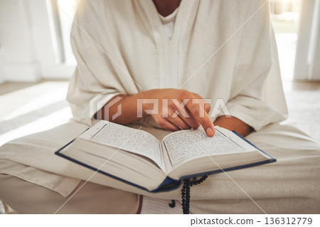 Reading book, muslim or hands of man with Quran on Eid Mubarak praying to God or worship at home. Allah, hope or Ramadan with spiritual person learning Islamic info for faith, religion and gratitude 136312779