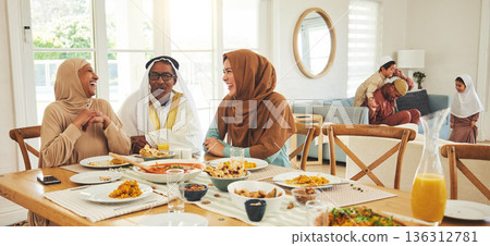 Food, relax and muslim with big family at table for eid mubarak, Islamic celebration and lunch. Ramadan festival, culture and iftar with people eating at home for fasting, islam and religion holiday 136312781