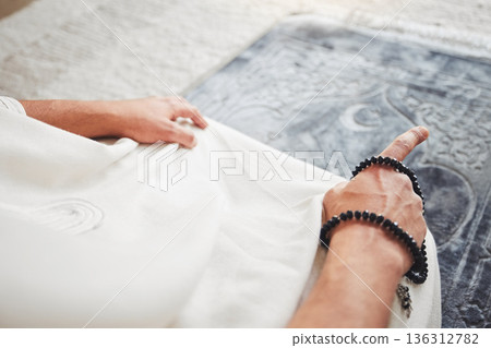 Prayer, muslim and worship with hand of man on living room floor for eid mubarak, God and islamic. Quran, hope and Ramadan with closeup of person praying at home for faith, religion and gratitude 136312782