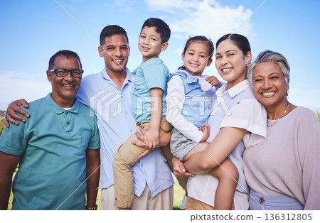 Big family, children and happy portrait on blue sky outdoor for fun, adventure and play on vacation. Young parents, grandparents and kids or Mexican people on nature holiday or at park with a smile 136312805
