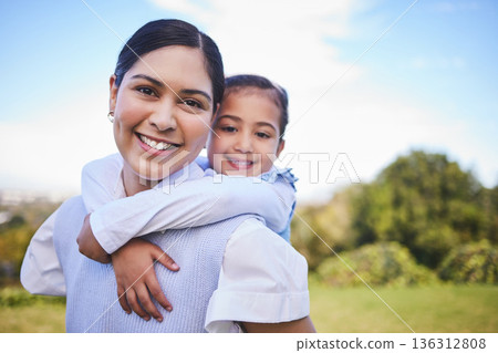 Happy mother, portrait and hug with child for quality time, bonding or love together in nature outdoors. Mom smile with daughter in piggyback enjoying summer weekend, holiday or vacation in the park 136312808