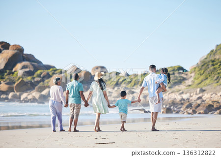 Beach, walking and grandparents, parents and children by sea for bonding, quality time and relax in nature. Family, travel and back of mom, dad and kids by ocean on holiday, vacation and adventure 136312822