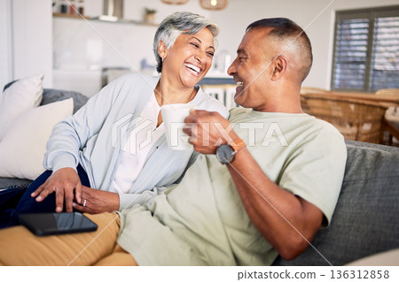 Happiness, sofa and mature couple with care pr love for quality time on weekend. Married, man and woman with coffee with living room in home for bond or to relax together with conversation or smile. Happiness, sofa and mature couple with care pr love for quality time on weekend. Married, man and woman with coffee with living room in home for bond or to relax together with conversation or smile. 136312858