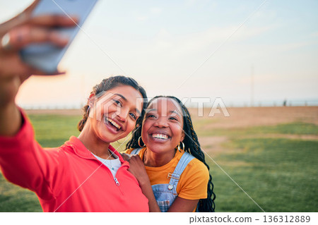 Selfie, happy and friends in nature for social media memory, update or together in summer. Smile, diversity and women taking a digital photo at a park for travel, vacation or relax on a holiday 136312889
