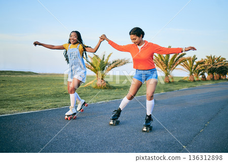 Roller skates, holding hands and friends on street for workout, exercise or training outdoor. Skating, happy people and girls together for sports on road to travel, journey and moving for fitness. 136312898