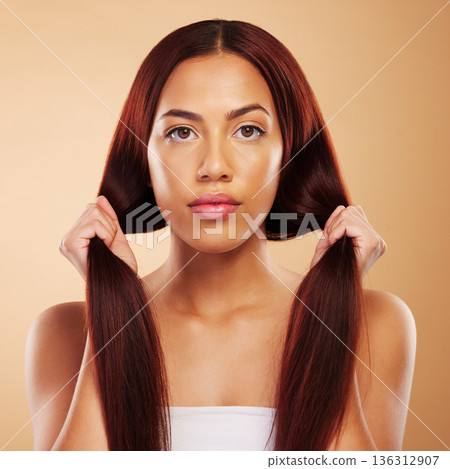 Haircare, beauty and portrait of woman with strong hair and luxury salon treatment on brown background. Aesthetic glow, haircut and care, natural face of model with cosmetics and makeup in studio. Haircare, beauty and portrait of woman with strong hair and luxury salon treatment on brown background. Aesthetic glow, haircut and care, natural face of model with cosmetics and makeup in studio. 136312907