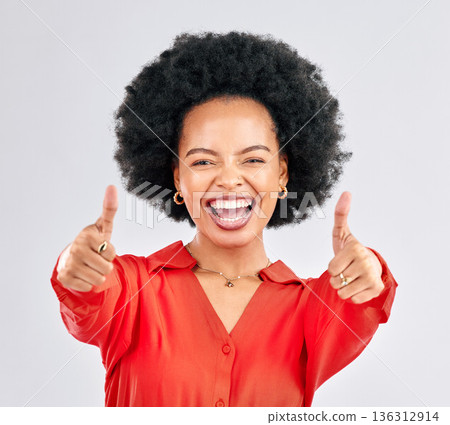 Thumbs up, happy and portrait of a businesswoman in studio with success, achievement or goal. Happiness, smile and professional African female person with an agreement hand gesture by gray background Thumbs up, happy and portrait of a businesswoman in studio with success, achievement or goal. Happiness, smile and professional African female person with an agreement hand gesture by gray background 136312914
