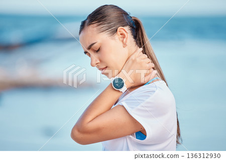 Outdoor, woman and shoulder or neck pain from exercise at the beach, ocean or workout to relax muscle, stress and strain. Massage, injury and training for sports, fitness or athlete in burnout Outdoor, woman and shoulder or neck pain from exercise at the beach, ocean or workout to relax muscle, stress and strain. Massage, injury and training for sports, fitness or athlete in burnout 136312930