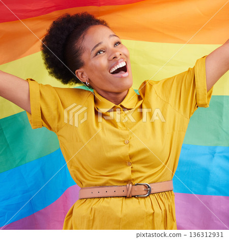 Pride, flag and happy black woman in studio for gay, rights and lgbtq life or choice. Rainbow, freedom and lesbian African female celebrating, smile and confident with inclusion and support Pride, flag and happy black woman in studio for gay, rights and lgbtq life or choice. Rainbow, freedom and lesbian African female celebrating, smile and confident with inclusion and support 136312931