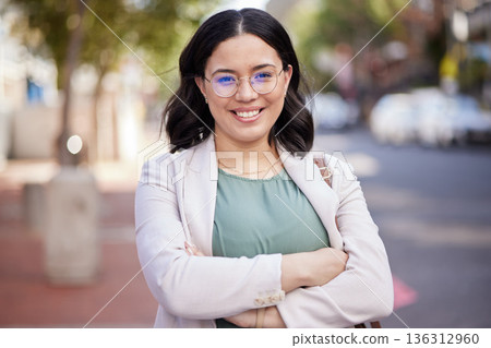 Happy, arms crossed and portrait of woman in city for corporate confidence, work and career. Smile, expert and a professional young female employee in the street or road for travel to the workplace 136312960