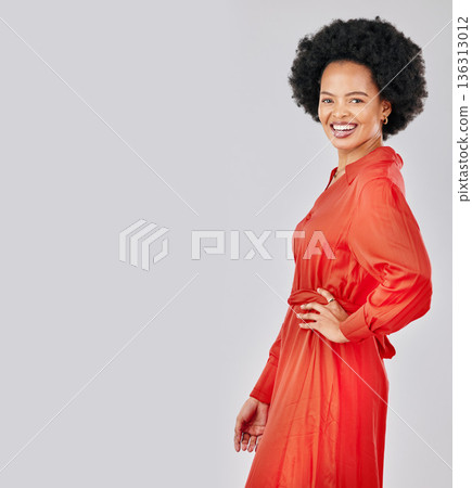 Portrait, fashion and space with an afro black woman in studio on a white background for trendy style. Mockup, smile and red clothes with a happy young female model posing in a clothing outfit 136313012