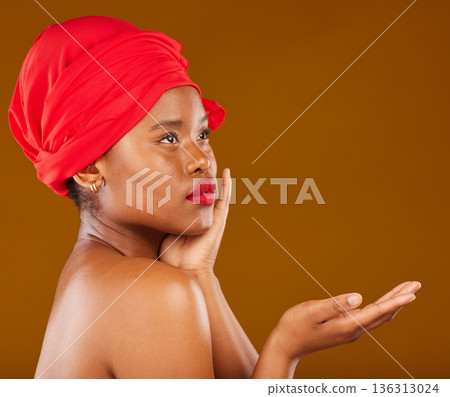 Beauty, makeup and presentation with face of black woman in studio for cosmetics, creative and show. Skincare, salon and mockup with female model on brown background for wellness, self care and glow 136313024