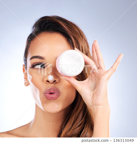 Beauty, skincare cream or woman with sunscreen product in daily grooming treatment with makeup cosmetics. Dermatology, white background or girl model applying facial creme or face lotion in studio 136313049