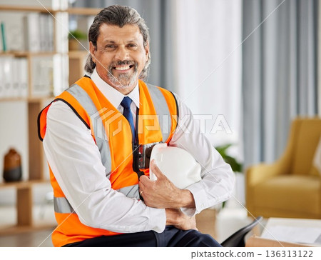 Construction, contractor and portrait of man in office for project management, development and industrial planning. Happy mature designer, building planner and engineering manager with safety helmet Construction, contractor and portrait of man in office for project management, development and industrial planning. Happy mature designer, building planner and engineering manager with safety helmet 136313122