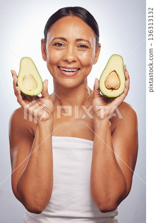 Portrait, skincare and senior woman with avocado in studio isolated on a white background. Face, natural fruit and happy model with food for vegan nutrition, healthy diet and omega 3 for anti aging. Portrait, skincare and senior woman with avocado in studio isolated on a white background. Face, natural fruit and happy model with food for vegan nutrition, healthy diet and omega 3 for anti aging. 136313132