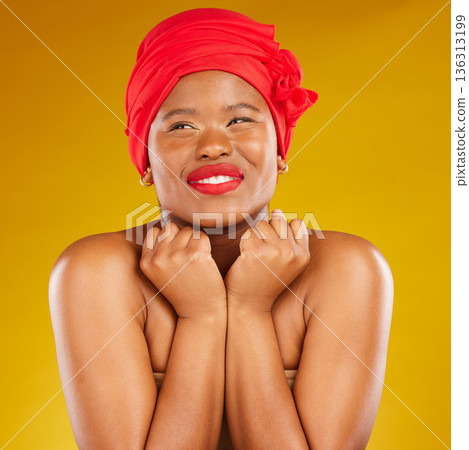 Beauty, excited and black woman with cosmetic makeup and head wrap with smile isolated in yellow studio background. Happy, skin and skincare by young female person scarf for dermatology or wellness 136313199