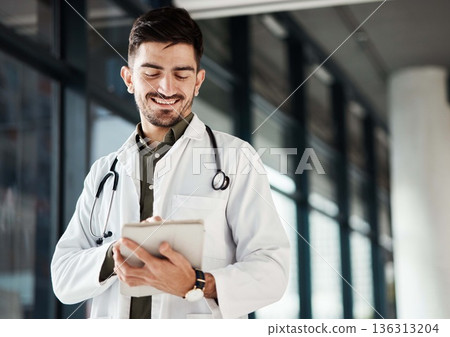 Happy, doctor and man with tablet in hospital for Telehealth, advice and social chat or research. Healthcare, news and male health expert smile for online, website or internet communication at clinic 136313204