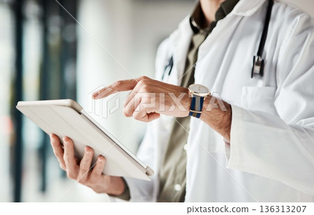 Hands, tablet and man doctor typing message, social media or planning online schedule in hospital. Telehealth, search and male healthcare expert with digital advice, chat or email, research or check Hands, tablet and man doctor typing message, social media or planning online schedule in hospital. Telehealth, search and male healthcare expert with digital advice, chat or email, research or check 136313207