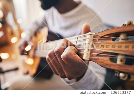 Closeup, hands of man and guitar for music, live talent and creative skill of sound production in home studio. Musician, singer or artist playing notes on acoustic instrument in solo jazz performance Closeup, hands of man and guitar for music, live talent and creative skill of sound production in home studio. Musician, singer or artist playing notes on acoustic instrument in solo jazz performance 136313377