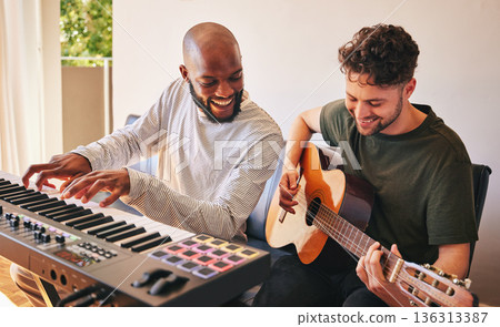 Friends, men and piano with guitar for happy song production in home studio together. Band, sound musicians and collaboration with keyboard, acoustic instrument and creative talent for performance Friends, men and piano with guitar for happy song production in home studio together. Band, sound musicians and collaboration with keyboard, acoustic instrument and creative talent for performance 136313387
