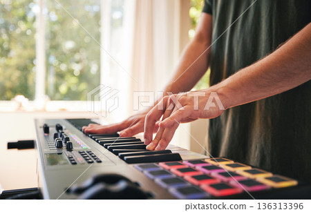 Hands, man and synthesizer piano for music, talent and skills in home studio. Closeup, musician and playing electrical keyboard for audio performance, sound artist and learning notes on instrument 136313396