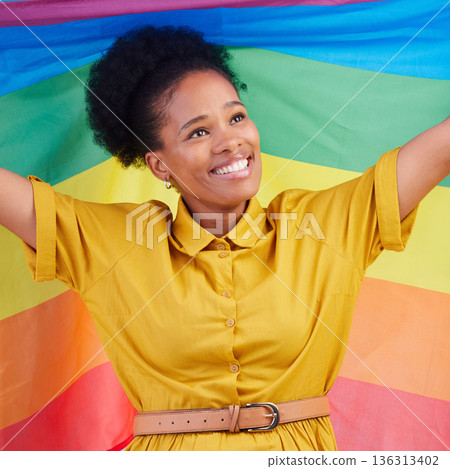 Gay, flag and happy black woman in studio for pride, rights and lgbtq lifestyle choice. Rainbow, freedom and face of lesbian African female smile, free and confident with queer sexuality or identity Gay, flag and happy black woman in studio for pride, rights and lgbtq lifestyle choice. Rainbow, freedom and face of lesbian African female smile, free and confident with queer sexuality or identity 136313402