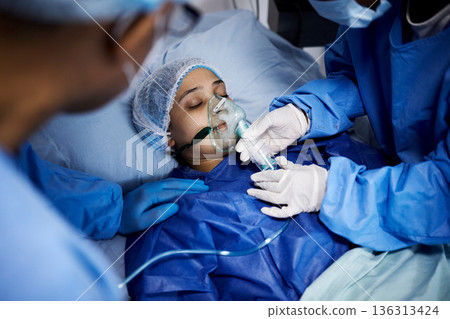 Doctor, hospital bed or sick woman with an oxygen mask, respiratory or operation for healthcare recovery. Medical surgeon, anesthesia or patient with breathing equipment for ventilation in emergency Doctor, hospital bed or sick woman with an oxygen mask, respiratory or operation for healthcare recovery. Medical surgeon, anesthesia or patient with breathing equipment for ventilation in emergency 136313424