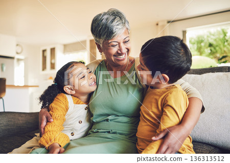 Hug, grandmother or happy kids on a sofa with love enjoying quality bonding time together in family home. Smile, affection or funny senior grandparent with children siblings on house couch laughing Hug, grandmother or happy kids on a sofa with love enjoying quality bonding time together in family home. Smile, affection or funny senior grandparent with children siblings on house couch laughing 136313512