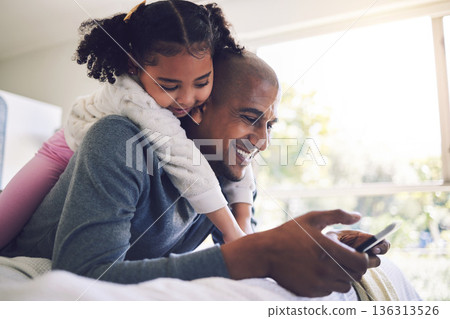 Father, girl and phone in bedroom together, relax and search for funny video, meme and happy in family home. Man, young daughter and smartphone on bed, watch comic movie or streaming cartoon on app Father, girl and phone in bedroom together, relax and search for funny video, meme and happy in family home. Man, young daughter and smartphone on bed, watch comic movie or streaming cartoon on app 136313526