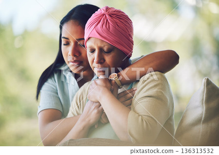 Love, sweet and woman with her mom with cancer hugging, bonding and spending time together. Recovery, chemotherapy and sick mature female person embracing her adult daughter in an outdoor garden. 136313532