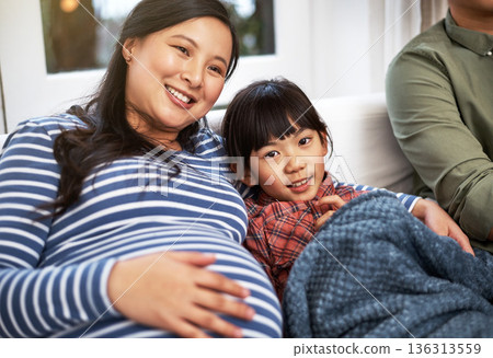 Portrait, sofa and child with pregnant mother in home watching tv with movie, film or show with bonding. Happy, pregnancy and Asian kid with mom for streaming series in living room together in house. Portrait, sofa and child with pregnant mother in home watching tv with movie, film or show with bonding. Happy, pregnancy and Asian kid with mom for streaming series in living room together in house. 136313559