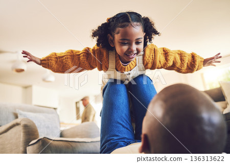 Young girl, father and playing, airplane and flying with freedom, bonding and happiness at home. People in living room, family house and relax, care free and playful with games, fun and man with kid Young girl, father and playing, airplane and flying with freedom, bonding and happiness at home. People in living room, family house and relax, care free and playful with games, fun and man with kid 136313622