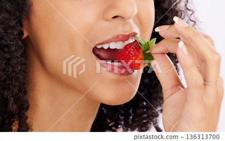 Healthy, eating or mouth of woman with strawberry in studio on white background for clean diet nutrition. Hand, bite closeup or girl model with beauty or natural fruits for nutrition or wellness 136313700