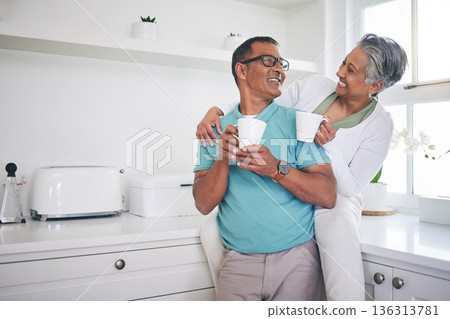 Love, coffee and happy with old couple in kitchen, for morning, relax and hug. Happiness, smile and peace with senior man and woman drinking tea at home for conversation, wake up and embrace Love, coffee and happy with old couple in kitchen, for morning, relax and hug. Happiness, smile and peace with senior man and woman drinking tea at home for conversation, wake up and embrace 136313781