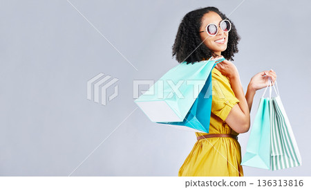 Woman, shopping and excited with bags at retail sale, promotion or happy for discount on studio, mockup or background. Customer, portrait and shop for fashion or sales on luxury clothing Woman, shopping and excited with bags at retail sale, promotion or happy for discount on studio, mockup or background. Customer, portrait and shop for fashion or sales on luxury clothing 136313816