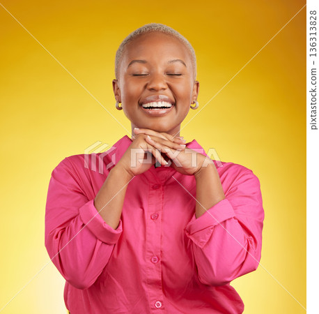 Happy, cute and black woman laughing in studio to funny, joke or silly memory on yellow background. Laughing, smile and African female remember, humor or goofy moment, good mood or positive attitude 136313828