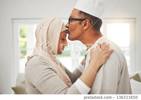 Home, Muslim elderly couple and forehead kiss, music slow dancing and bond for love, trust and care with kindness. Commitment, Islamic and Arab man, woman and senior people together for quality time Home, Muslim elderly couple and forehead kiss, music slow dancing and bond for love, trust and care with kindness. Commitment, Islamic and Arab man, woman and senior people together for quality time 136313850
