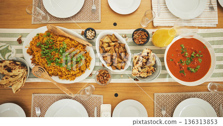 Food, Eid Mubarak and above of lunch for family at table for Islamic celebration, festival and dinner. Ramadan, religion and top view of feast, meal and cuisine for fasting, holiday and culture 136313853