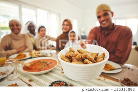 Food, offer and muslim with big family at table for eid mubarak, Islamic celebration and lunch. Ramadan festival, culture and iftar with people eating at home for fasting, islam and religion holiday Food, offer and muslim with big family at table for eid mubarak, Islamic celebration and lunch. Ramadan festival, culture and iftar with people eating at home for fasting, islam and religion holiday 136313898