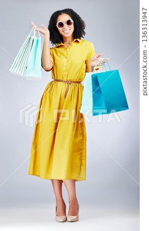 Happy woman, portrait and shopping bags for fashion or style against a white studio background. Excited female person, customer or shopper smile for discount, sale or purchase in promotion with gifts Happy woman, portrait and shopping bags for fashion or style against a white studio background. Excited female person, customer or shopper smile for discount, sale or purchase in promotion with gifts 136313947