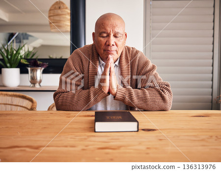 Senior man, bible and praying in home with faith, religion and mindfulness for peace, gratitude and Jesus. Elderly person, eyes closed and worship christian God with spiritual mindset, focus or trust Senior man, bible and praying in home with faith, religion and mindfulness for peace, gratitude and Jesus. Elderly person, eyes closed and worship christian God with spiritual mindset, focus or trust 136313976