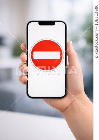 Child holding smartphone with digital access restriction symbol Child holding smartphone with digital access restriction symbol 136313986