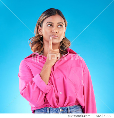 Thinking, planning and a woman on a blue background with knowledge, idea and inspiration. Dream, young and an Indian girl with a vision of an opportunity, decision or a choice isolated on a backdrop Thinking, planning and a woman on a blue background with knowledge, idea and inspiration. Dream, young and an Indian girl with a vision of an opportunity, decision or a choice isolated on a backdrop 136314009