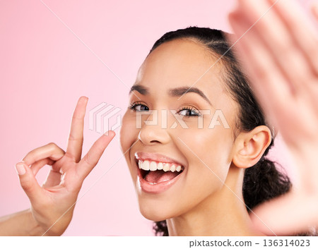 Selfie, peace sign and happy woman in studio with natural beauty, wellness and cosmetics. Portrait, female person and pink background with makeup and face with skincare and emoji hand gesture of girl Selfie, peace sign and happy woman in studio with natural beauty, wellness and cosmetics. Portrait, female person and pink background with makeup and face with skincare and emoji hand gesture of girl 136314023