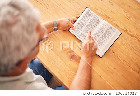 Above, reading book or old man with holy bible for worship, support or hope in Christianity faith in retirement. Jesus, God or senior person studying or learning gospel prayer in spiritual religion 136314028