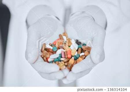 Pharmacy, medicine and pills with hands of doctor for offer, wellness and supplements. Pharmacist, medical and healthcare with closeup of person and capsules for vitamins, product and prescription 136314104