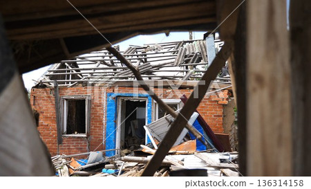 View to destroyed residential buildings at Kharkivska oblast. Ruined houses after bomb attacks on ukrainian territory from russia army. Consequences of russian invasion of Ukraine. Slow motion 136314158